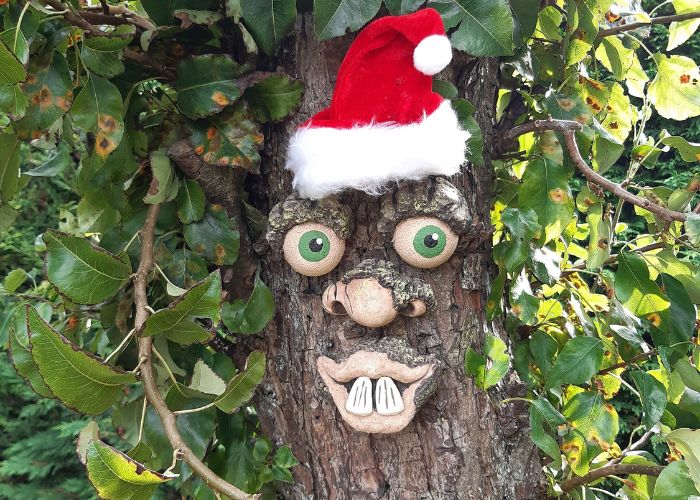 How Do You Install and Style Tree Face Decorations in a Garden?
