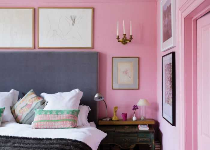 How can you create a stylish and cohesive pink bedroom decor?